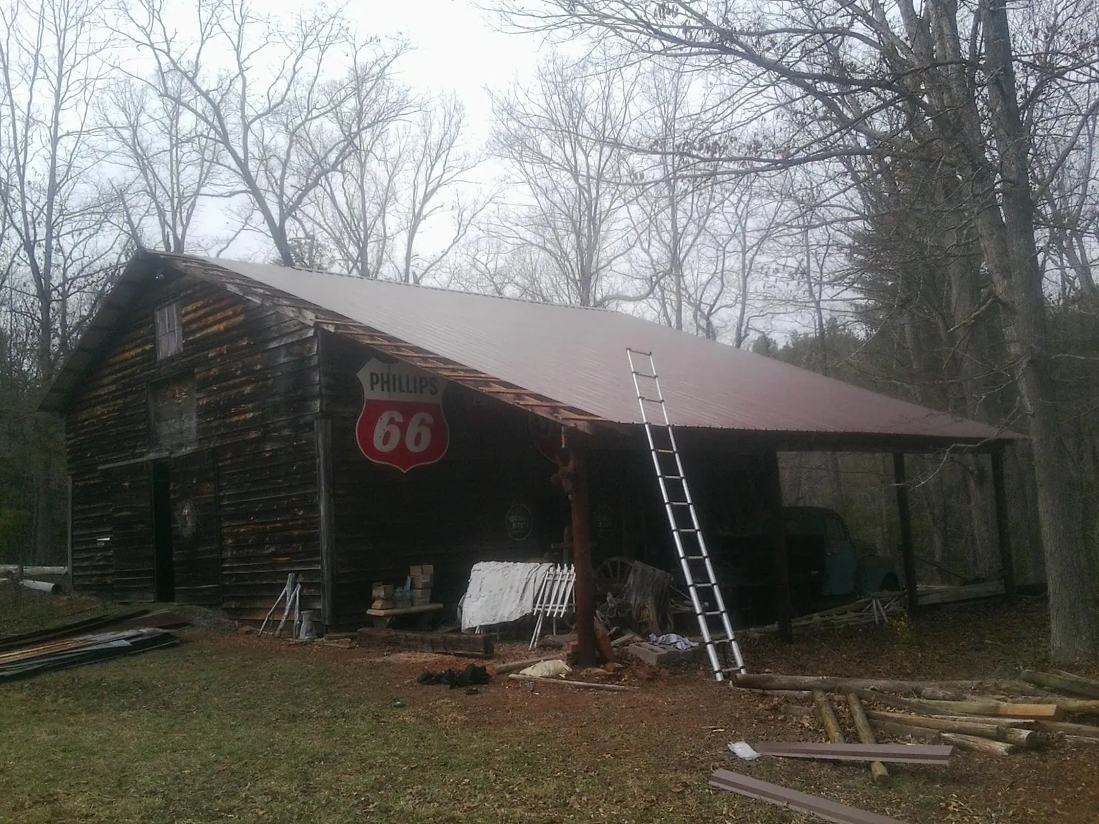 New metal roof on an open sided timber barn with a vintage sign in Mount Laguna